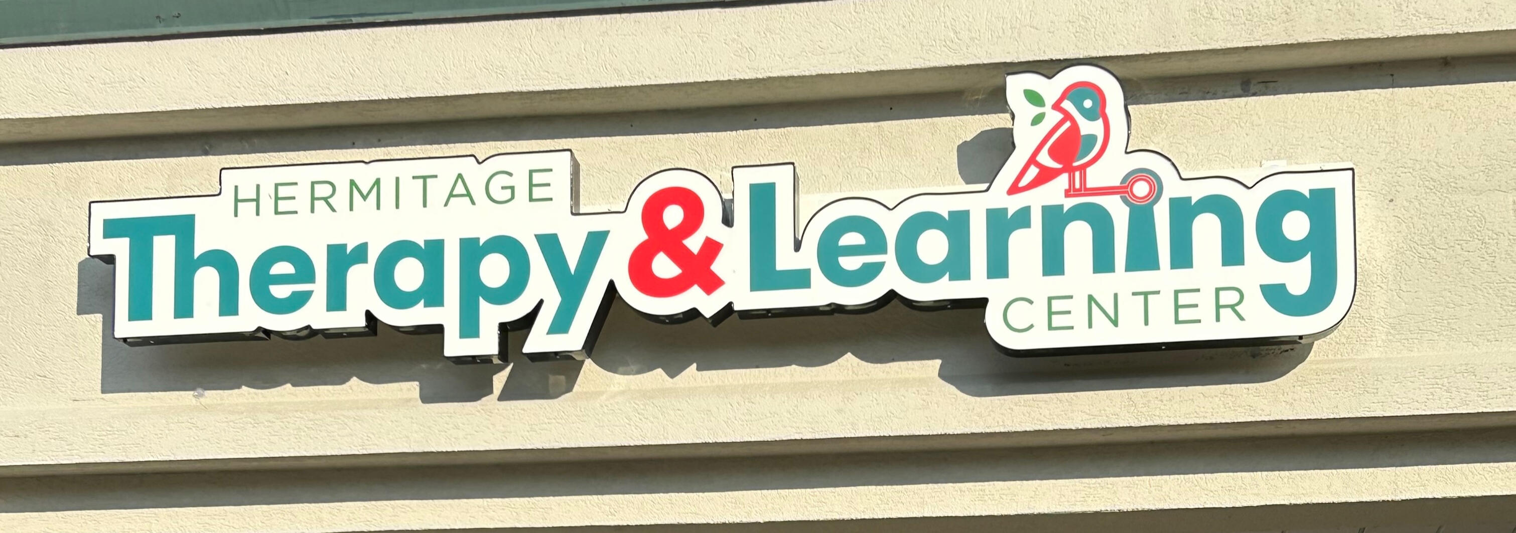 The Hermitage Therapy & Learning Center logo.